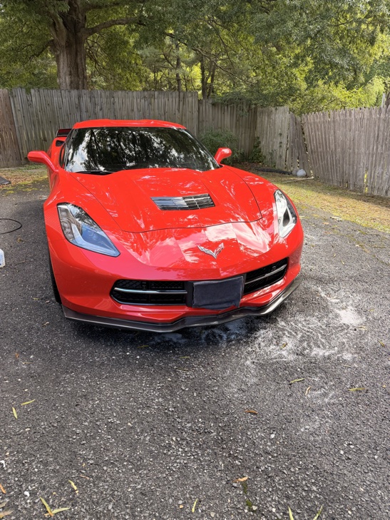 Red C7 Corvette after a full detail